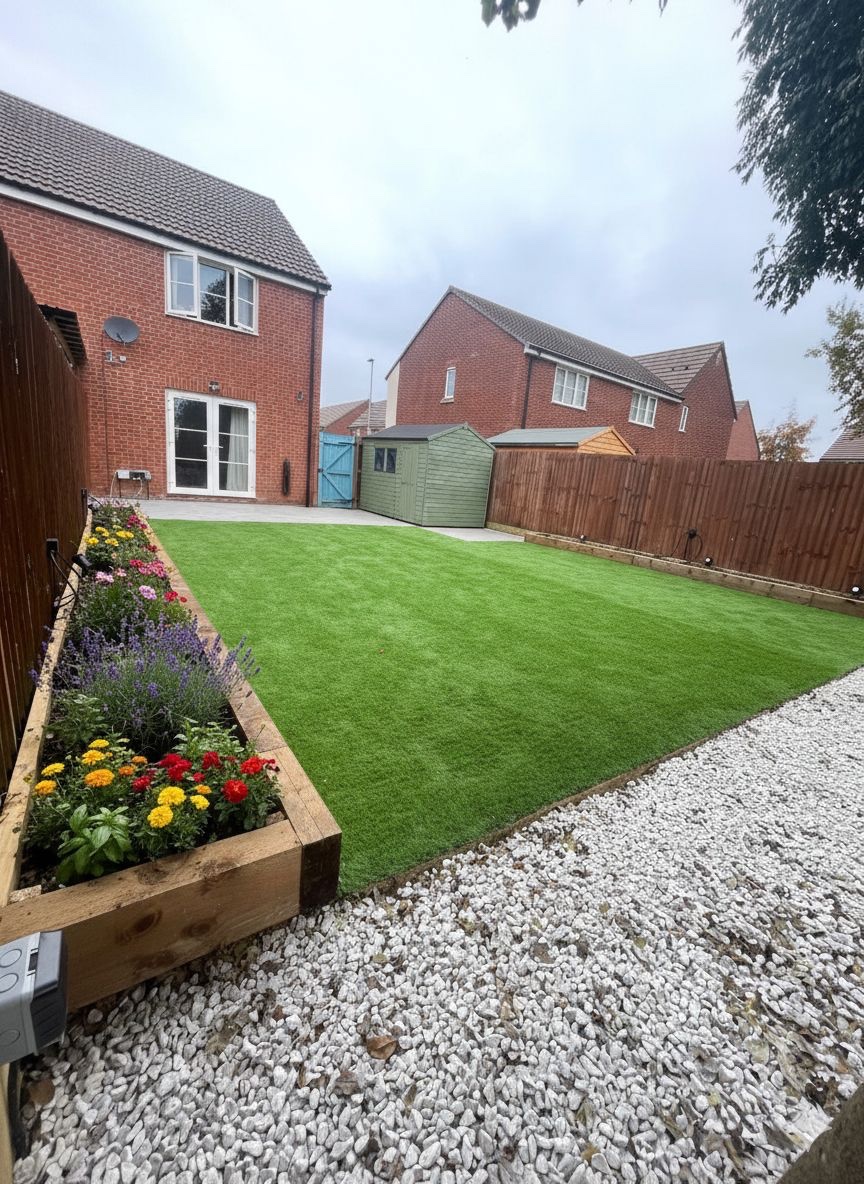 Flower bed and stone border beside the landscaped lawn
