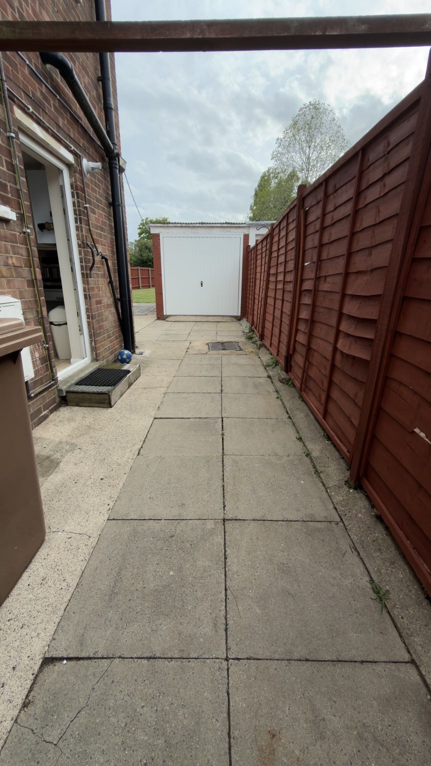 The same side access after clearing weeds and debris