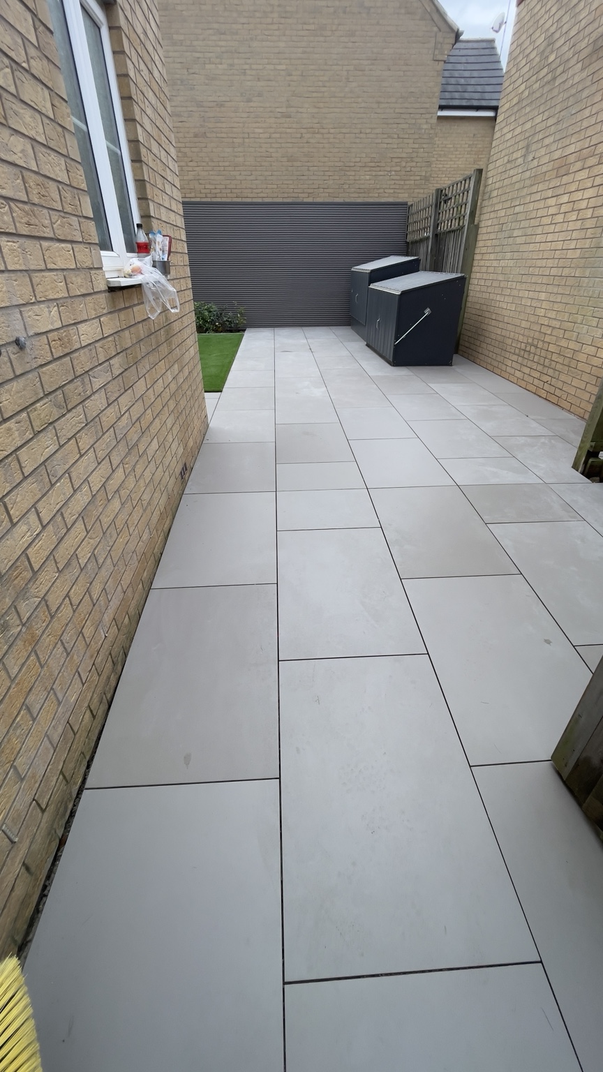 Neat paved side access between two houses